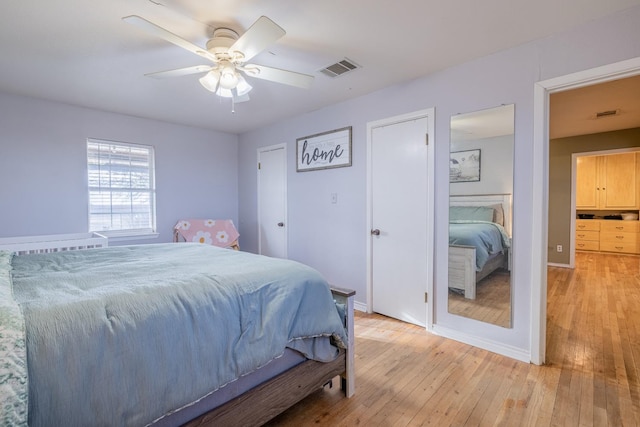 bedroom featuring ceiling fan and light hardwood / wood-style flooring