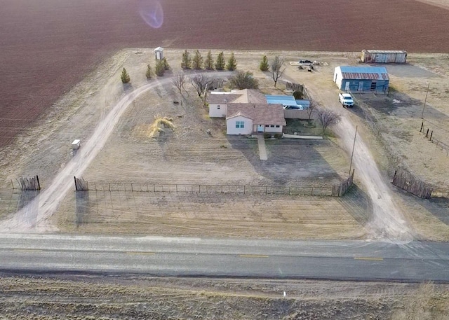 birds eye view of property featuring a rural view