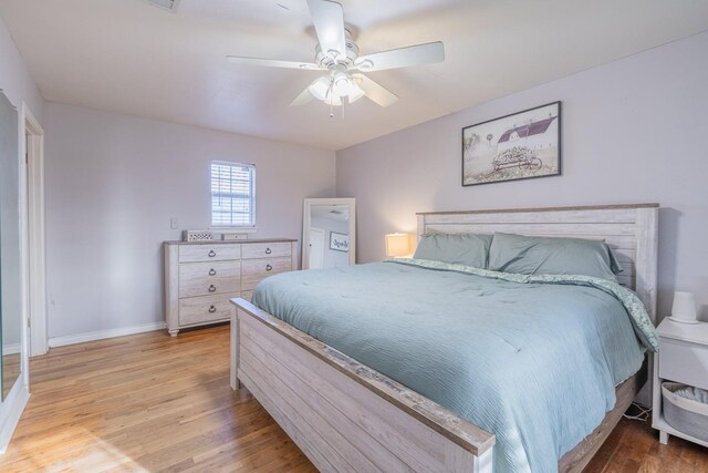 bedroom featuring light hardwood / wood-style flooring and ceiling fan