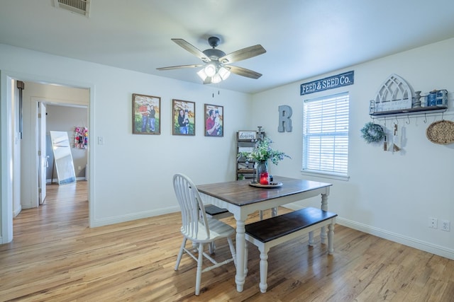 dining space featuring light hardwood / wood-style flooring and ceiling fan