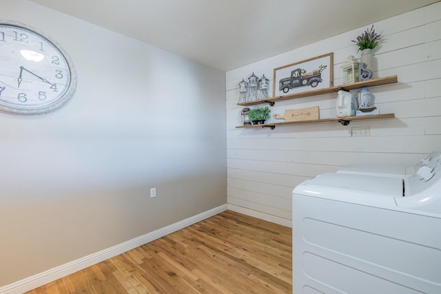 interior space with separate washer and dryer and hardwood / wood-style floors