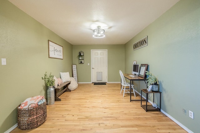 office space with light wood-type flooring