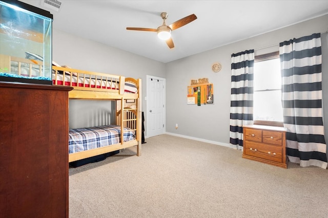 bedroom featuring light carpet and ceiling fan