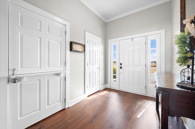 foyer entrance featuring crown molding and dark hardwood / wood-style floors