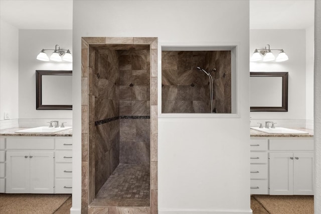 bathroom featuring vanity and a tile shower