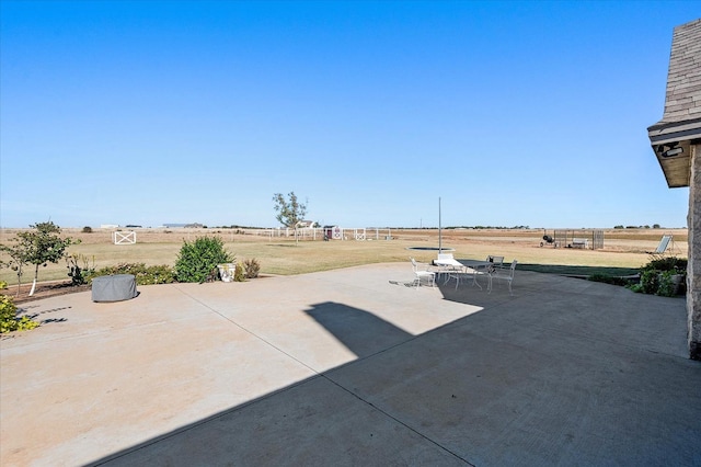 view of patio / terrace with a rural view