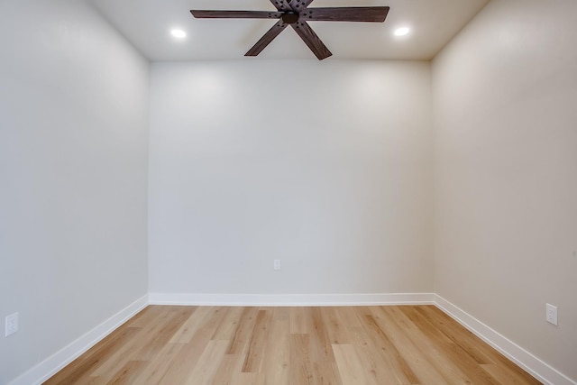 spare room with wood-type flooring and ceiling fan