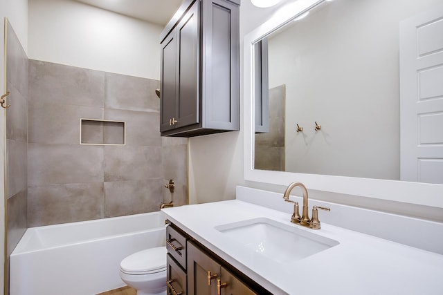 full bathroom featuring vanity, toilet, and tiled shower / bath combo