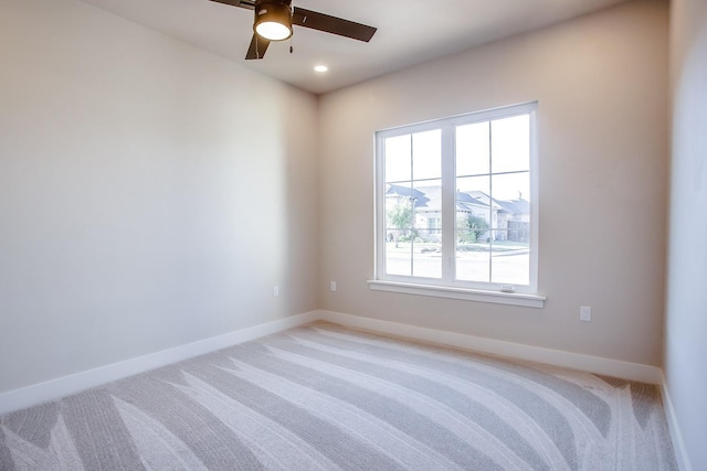 carpeted empty room with ceiling fan