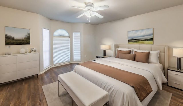 bedroom featuring ceiling fan and dark hardwood / wood-style flooring