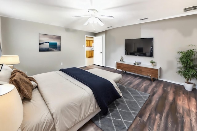 bedroom with dark hardwood / wood-style floors and ceiling fan