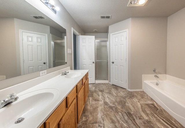 bathroom featuring vanity and separate shower and tub