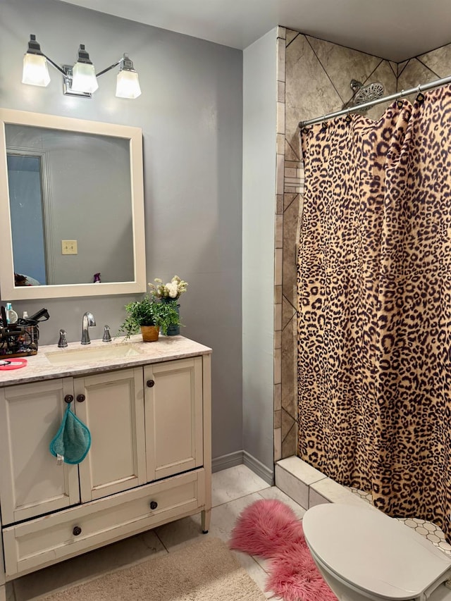 bathroom featuring vanity, tile patterned floors, toilet, and walk in shower