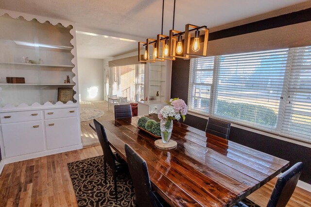 dining space featuring light hardwood / wood-style floors