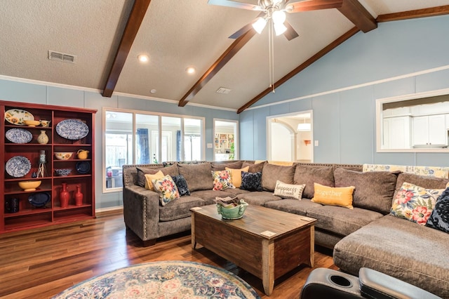 living room with hardwood / wood-style floors, lofted ceiling with beams, a textured ceiling, and ceiling fan