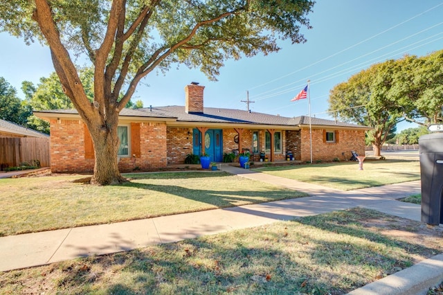 ranch-style house featuring a front yard