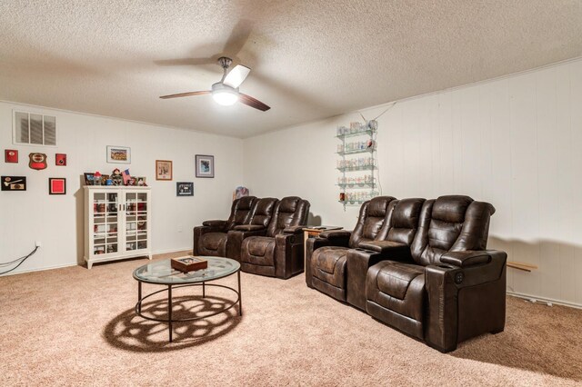 cinema featuring carpet floors, a textured ceiling, and ceiling fan