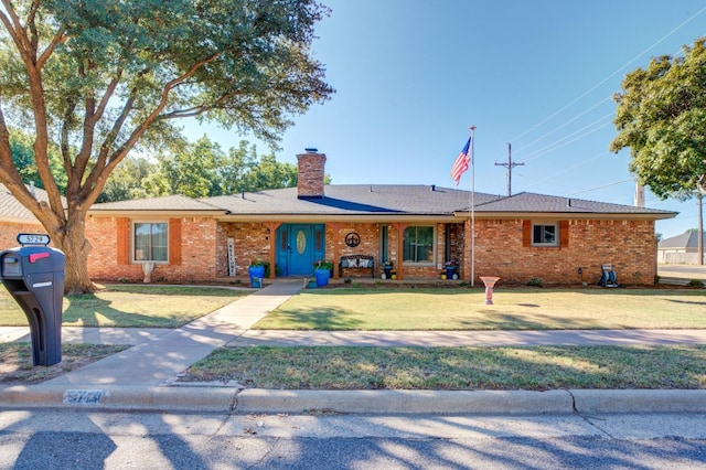 single story home with a front yard