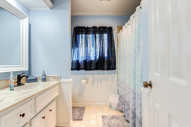 bathroom with tile patterned flooring and vanity