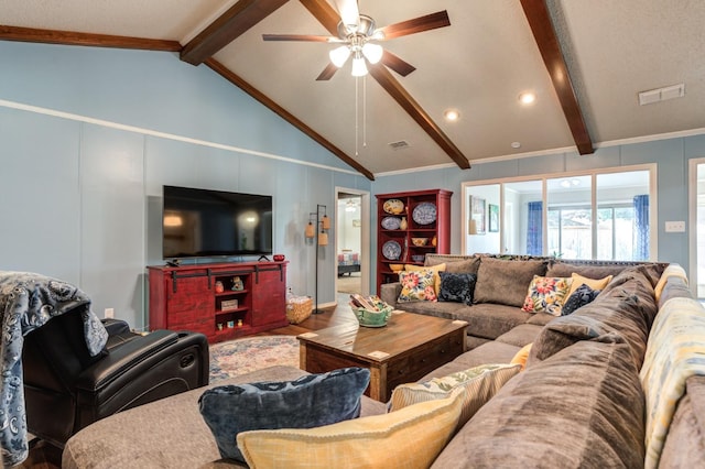 living room with hardwood / wood-style floors, ornamental molding, lofted ceiling with beams, and ceiling fan