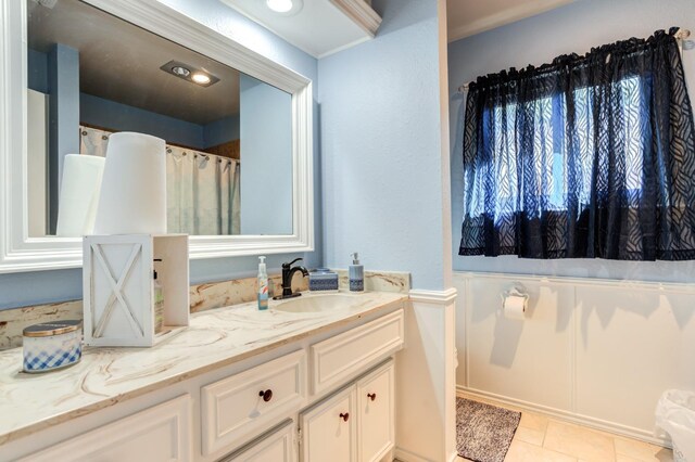 bathroom with tile patterned floors and vanity