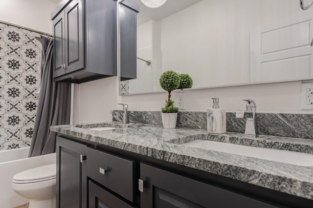 full bathroom featuring vanity, shower / bathtub combination with curtain, and toilet