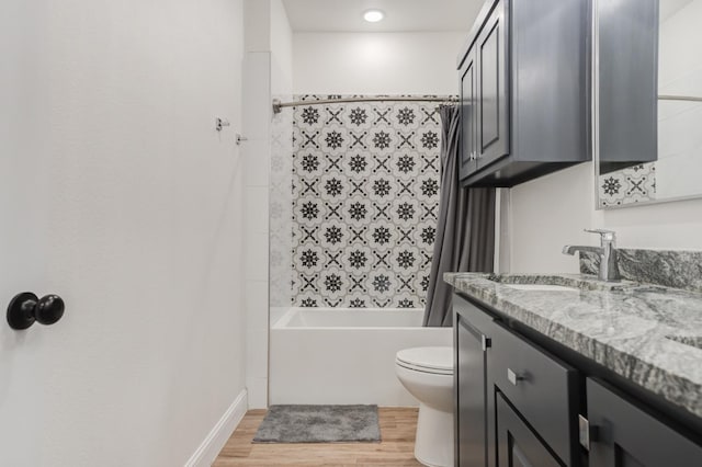 full bathroom featuring shower / bathtub combination with curtain, vanity, wood-type flooring, and toilet