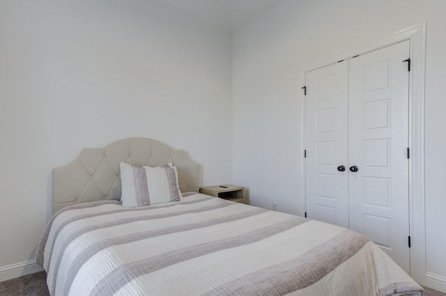 carpeted bedroom with a closet