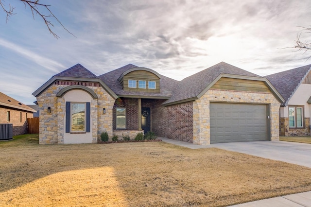 view of front of house with a garage and a front yard