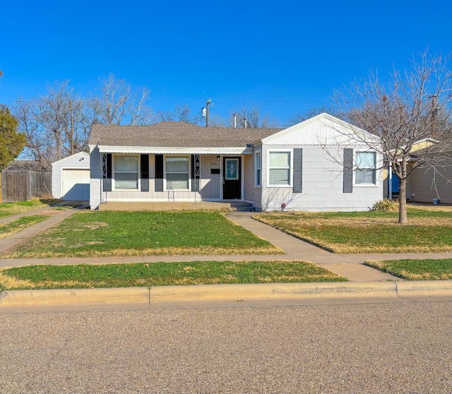 ranch-style house featuring a front lawn and covered porch