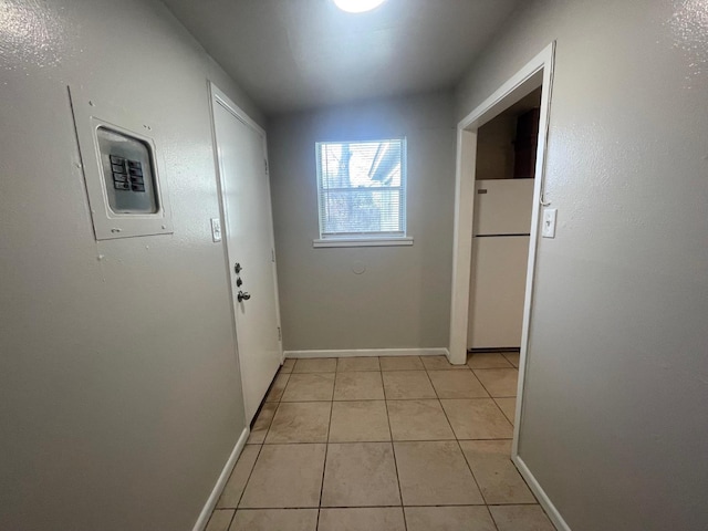 corridor featuring light tile patterned floors