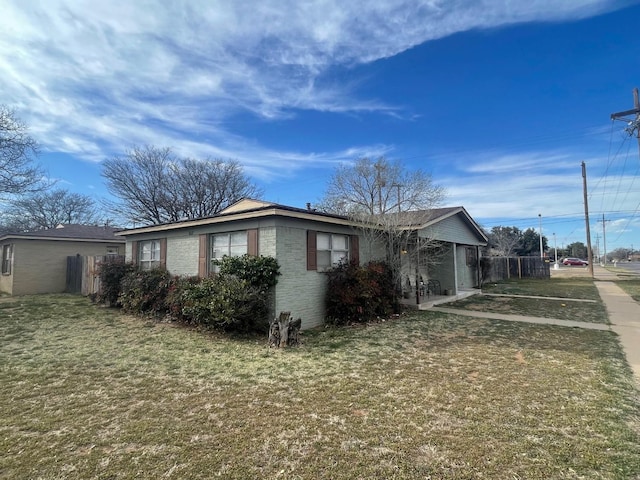 view of property exterior featuring a lawn