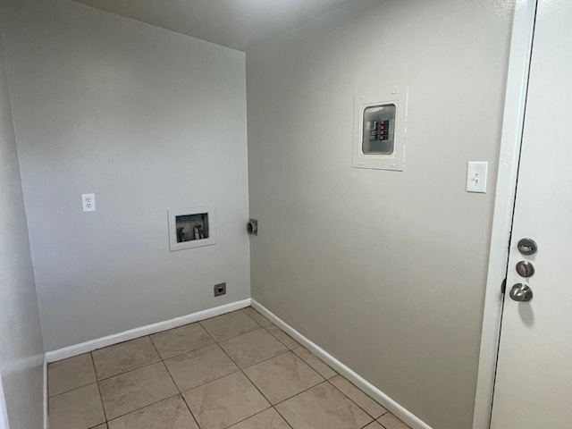 washroom with hookup for a washing machine, light tile patterned flooring, and hookup for an electric dryer