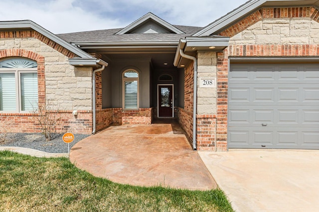 208 Berkshire Ave, Wolfforth, TX 79382 - doorway to property with an attached garage, brick siding, roof with shingles, and stone siding
