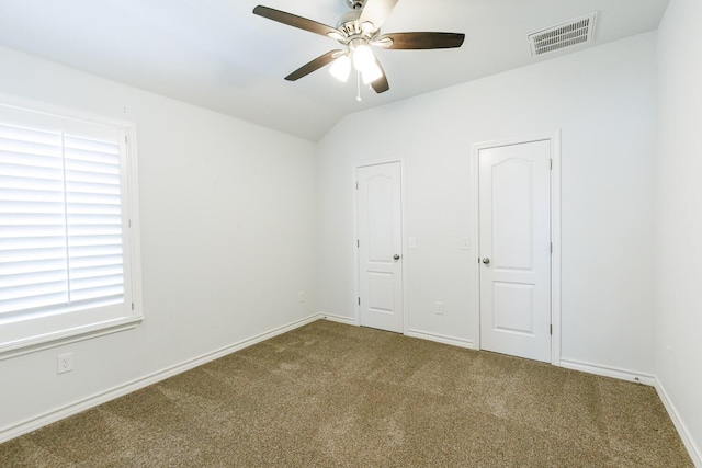 208 Berkshire Ave, Wolfforth, TX 79382 - carpeted empty room with vaulted ceiling, baseboards, a ceiling fan, and visible vents