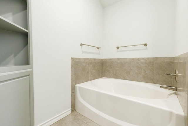 208 Berkshire Ave, Wolfforth, TX 79382 - full bath with tile patterned flooring, baseboards, and a bath