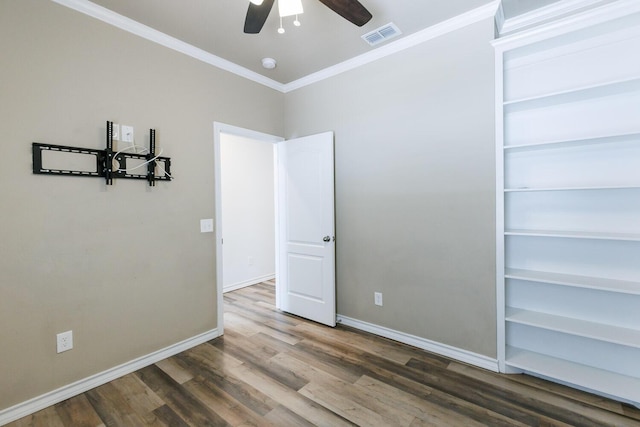 208 Berkshire Ave, Wolfforth, TX 79382 - spare room with visible vents, crown molding, wood finished floors, baseboards, and a ceiling fan