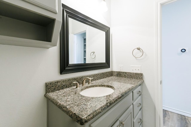 208 Berkshire Ave, Wolfforth, TX 79382 - bathroom with vanity and wood finished floors