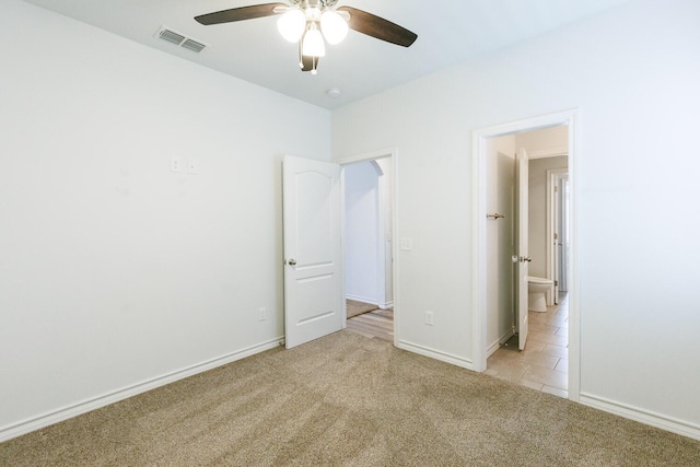 208 Berkshire Ave, Wolfforth, TX 79382 - unfurnished bedroom with light carpet, a ceiling fan, baseboards, light tile patterned floors, and visible vents