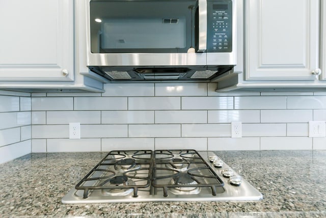 208 Berkshire Ave, Wolfforth, TX 79382 - room details with white cabinets, tasteful backsplash, stone counters, and stainless steel appliances