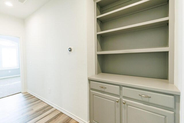 208 Berkshire Ave, Wolfforth, TX 79382 - corridor with light wood-style floors and baseboards