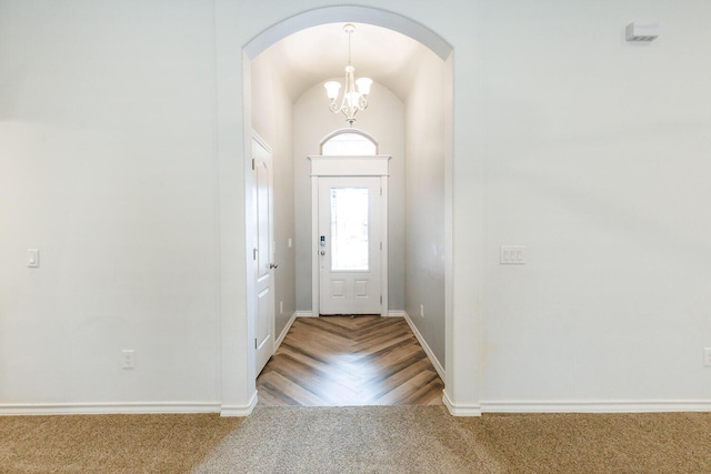 208 Berkshire Ave, Wolfforth, TX 79382 - entryway with baseboards, carpet, arched walkways, and a chandelier