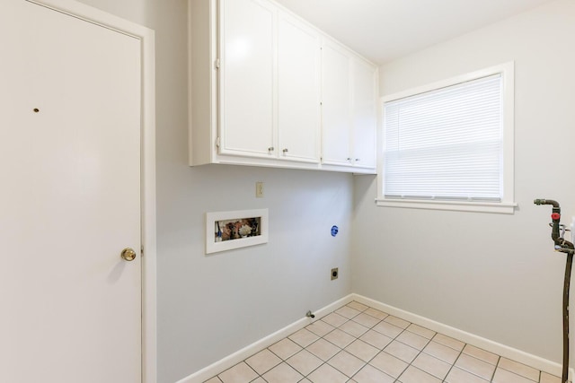 5418 15th St, Lubbock, TX 79416 - laundry room featuring hookup for a washing machine, electric dryer hookup, cabinet space, gas dryer hookup, and light tile patterned floors