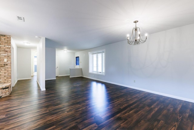 5418 15th St, Lubbock, TX 79416 - unfurnished living room with a chandelier and dark wood-style flooring