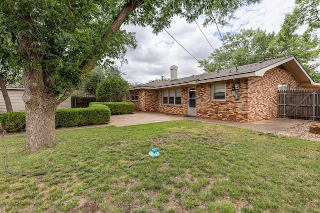 5418 15th St, Lubbock, TX 79416 - rear view of house featuring a patio and brick siding