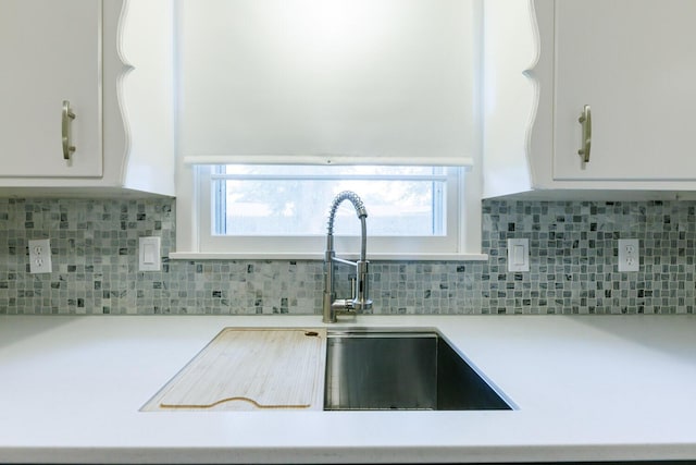 5418 15th St, Lubbock, TX 79416 - kitchen with light countertops, white cabinetry, and tasteful backsplash