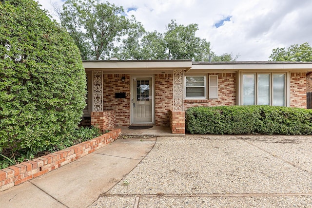 5418 15th St, Lubbock, TX 79416 - property entrance featuring brick siding