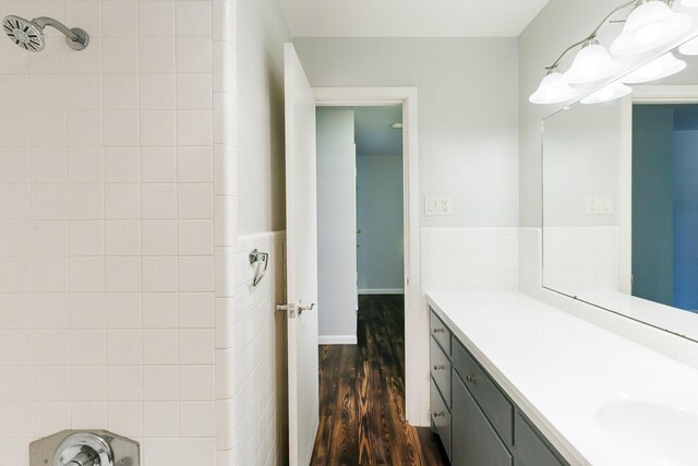 5418 15th St, Lubbock, TX 79416 - bathroom featuring wood finished floors, vanity, and a wainscoted wall