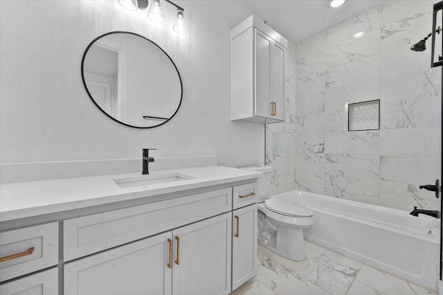 full bathroom with tiled shower / bath, vanity, and toilet