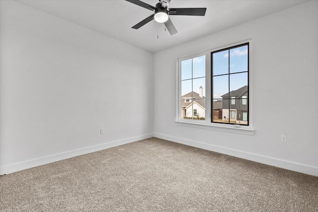 spare room with ceiling fan and carpet flooring